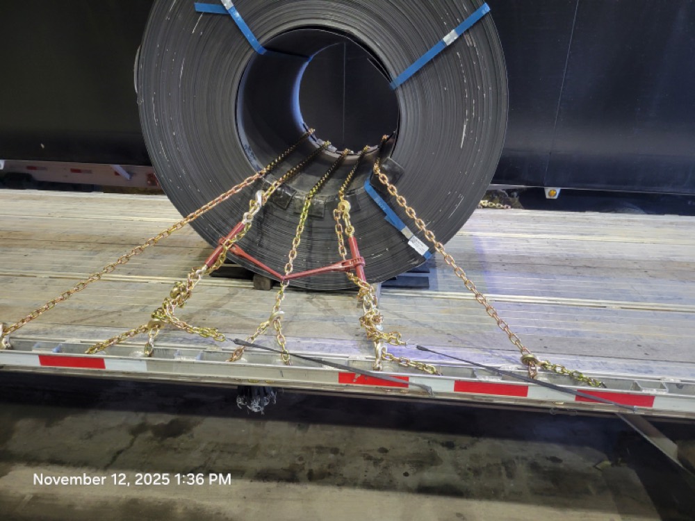 Properly secured steel beams on flatbed trailer