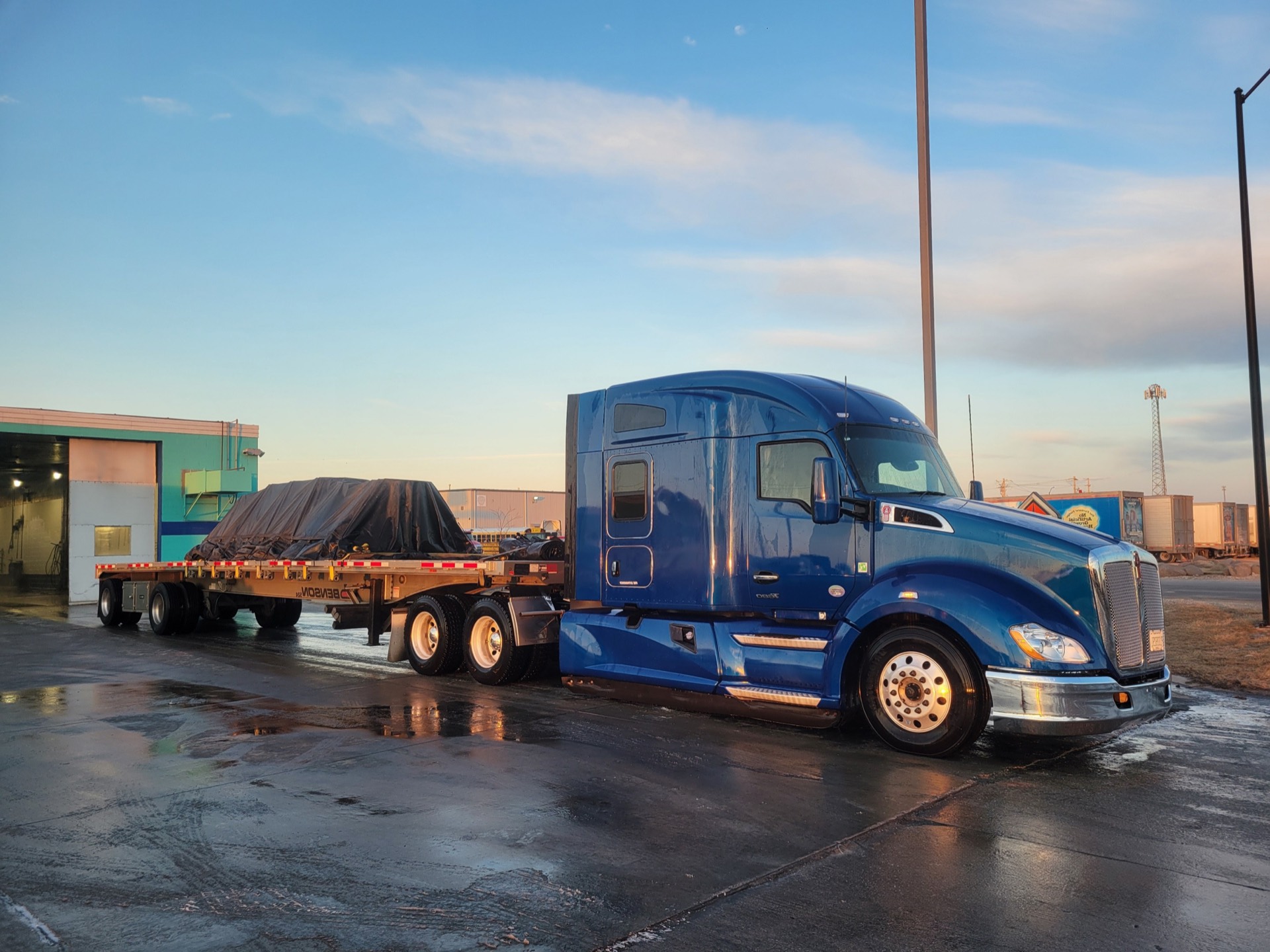 Freshly washed Pioneer Roadways Kenworth T680 flatbed truck