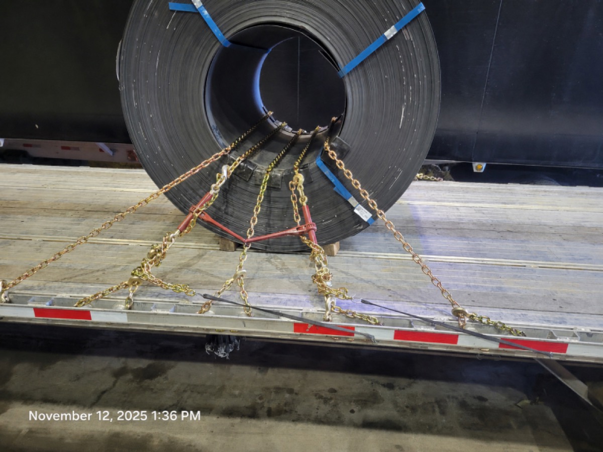 Steel coil properly secured on a Pioneer Roadways flatbed trailer